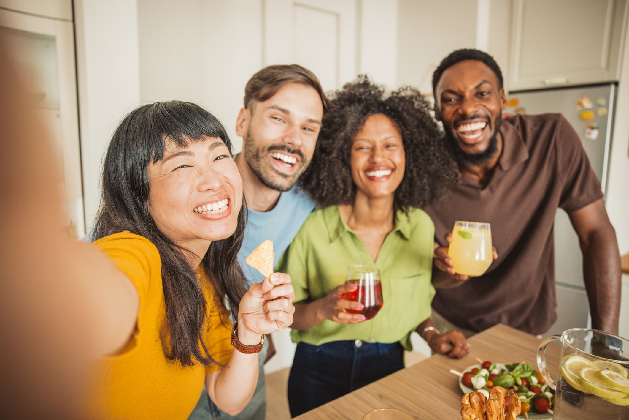 Friends laughing together at a holiday party